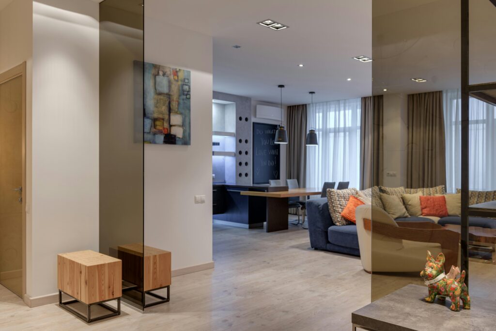 Spacious and elegant living room with modern furniture and stylish decor, perfect for relaxation.